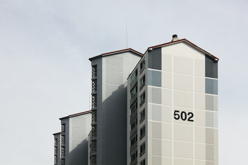 white and black concrete building under white sky during daytime