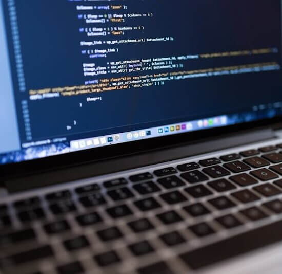 Focused view of programming code displayed on a laptop, ideal for tech and coding themes.