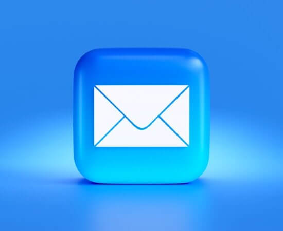 a blue button with a white envelope on it